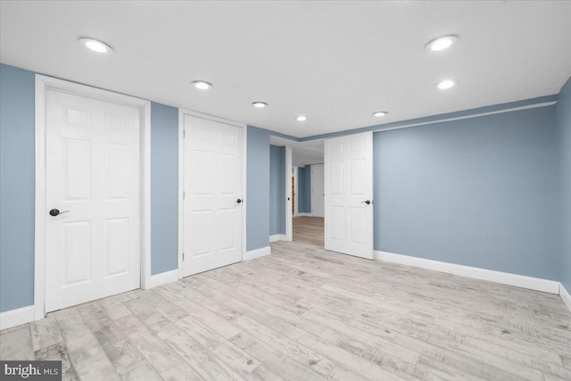 basement featuring light hardwood / wood-style floors