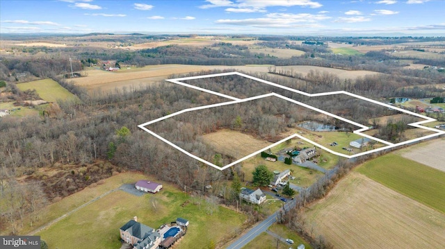 birds eye view of property featuring a rural view