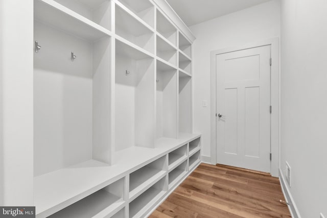 mudroom with wood-type flooring