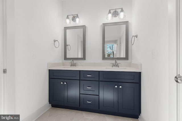 bathroom featuring tile patterned flooring and vanity