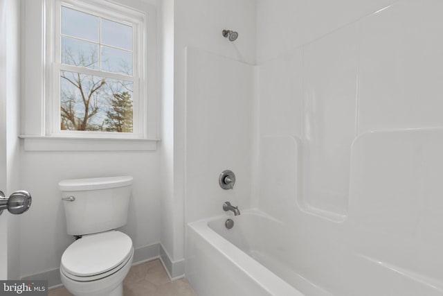 bathroom with tile patterned floors,  shower combination, and toilet