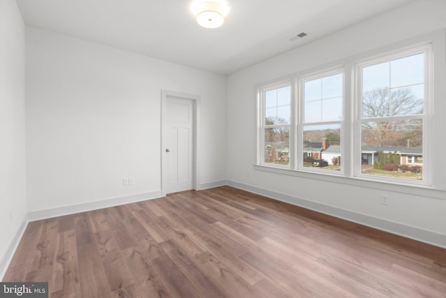 empty room featuring hardwood / wood-style floors