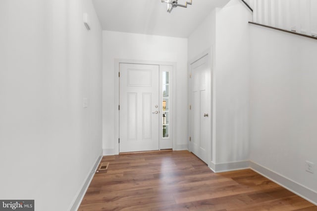 entryway with wood-type flooring