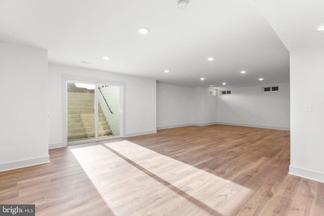 spare room with light wood-type flooring