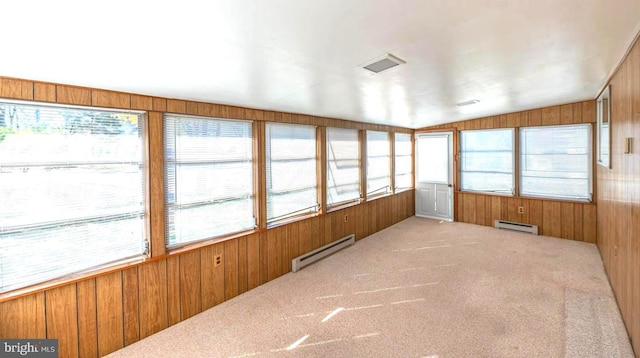 unfurnished sunroom featuring lofted ceiling and baseboard heating