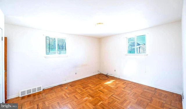 empty room featuring light parquet flooring