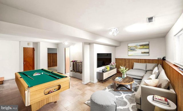 rec room with wooden walls and pool table