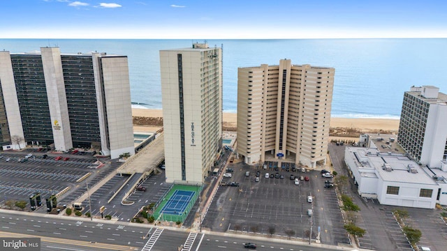 aerial view with a water view and a view of the beach