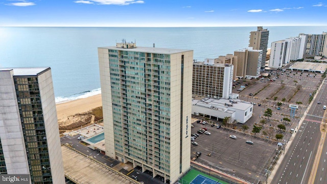 bird's eye view featuring a view of the beach and a water view