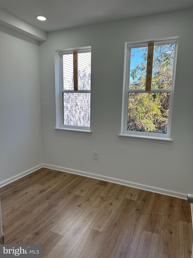 unfurnished room featuring wood-type flooring