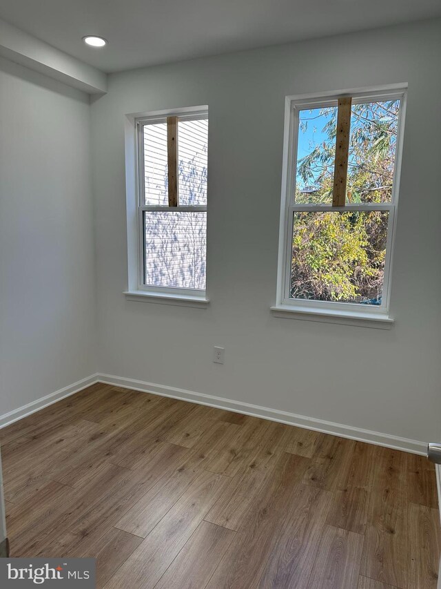 2215 N 10th St, Philadelphia, PA 19133 - spare room with wood finished floors, healthy amount of natural light, and recessed lighting
