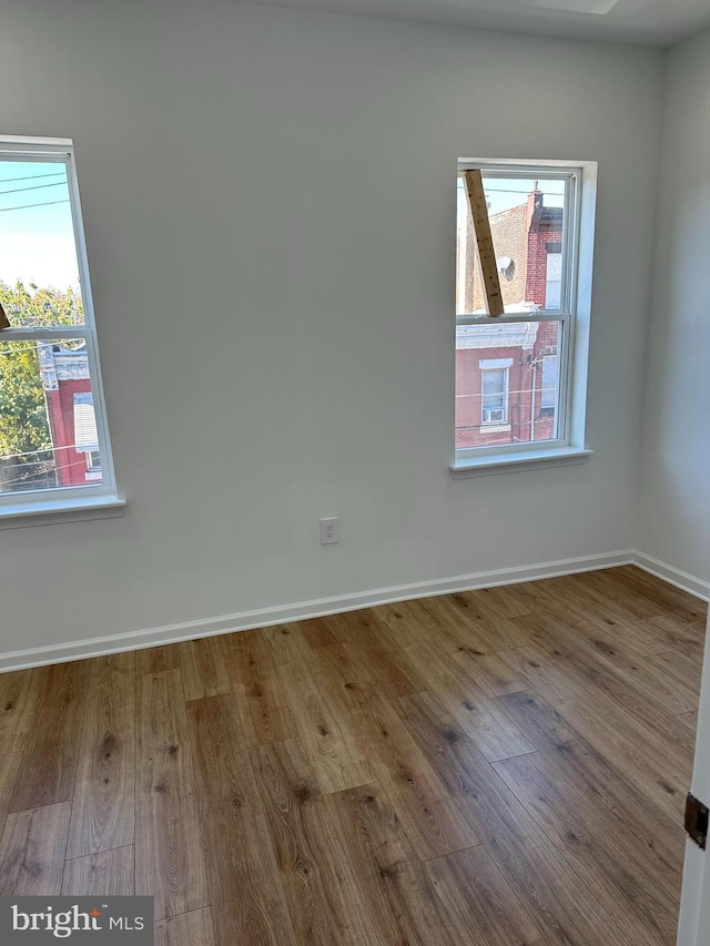 2215 N 10th St, Philadelphia, PA 19133 - empty room featuring wood finished floors and plenty of natural light