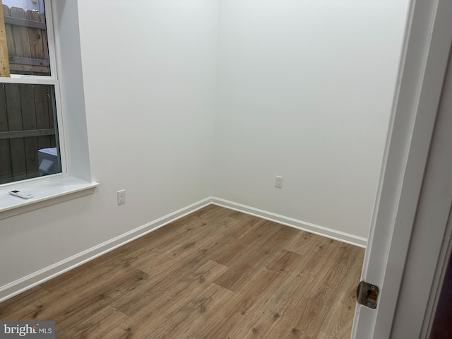 empty room featuring hardwood / wood-style flooring