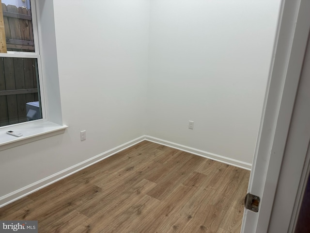 2215 N 10th St, Philadelphia, PA 19133 - empty room featuring wood finished floors and baseboards