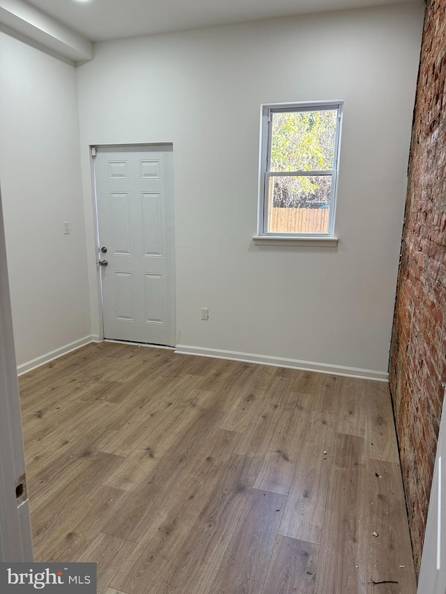 2215 N 10th St, Philadelphia, PA 19133 - spare room featuring wood finished floors and baseboards