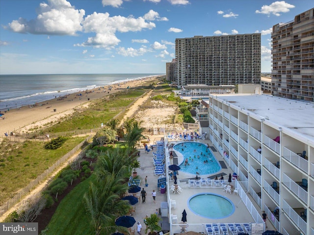 bird's eye view featuring a beach view and a water view