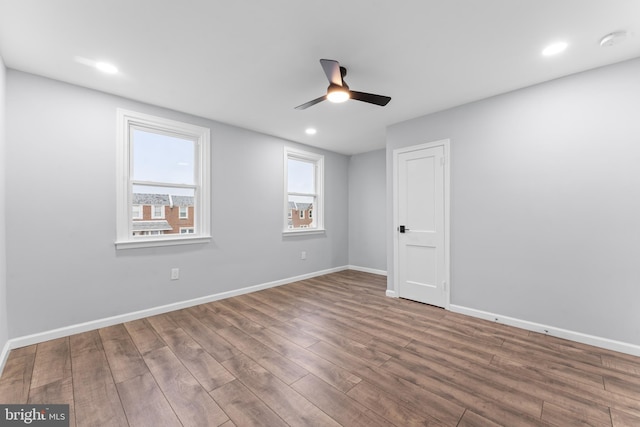 unfurnished room featuring hardwood / wood-style flooring and ceiling fan