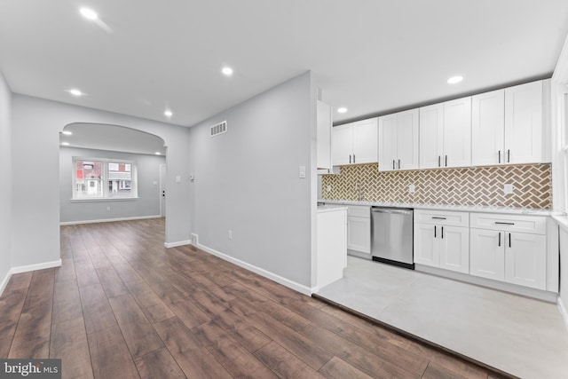 kitchen with dishwasher, white cabinets, and wood-type flooring