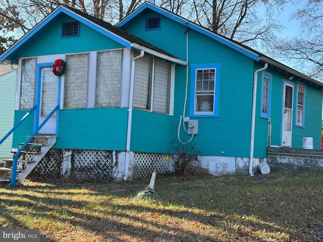 view of property exterior featuring a yard