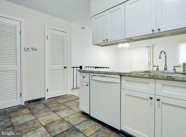 kitchen featuring white cabinetry, sink, and white dishwasher