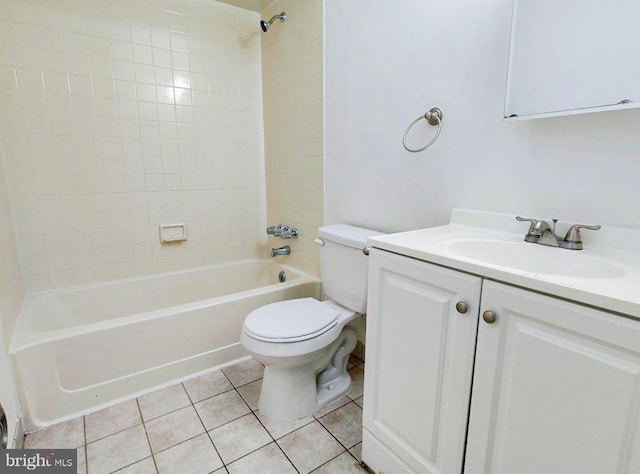 full bathroom featuring tile patterned floors, vanity, tiled shower / bath combo, and toilet