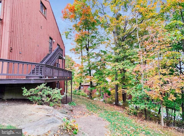 view of yard with a wooden deck