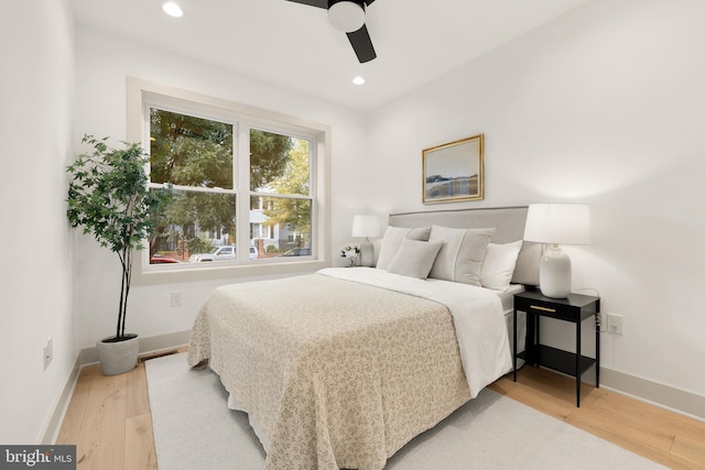 bedroom with wood-type flooring and ceiling fan