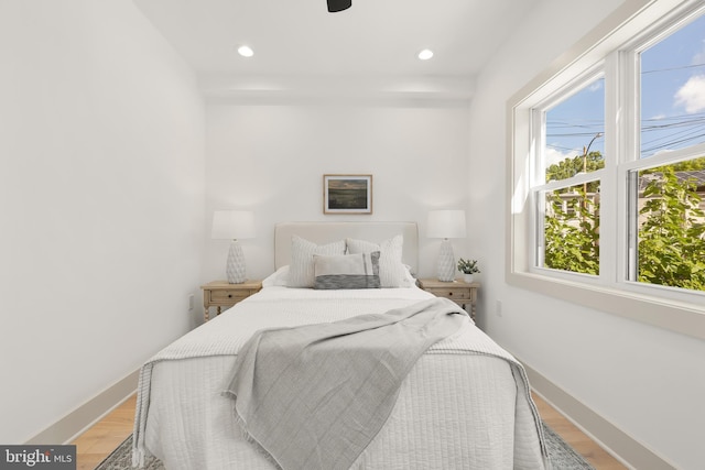 bedroom featuring ceiling fan and light hardwood / wood-style floors