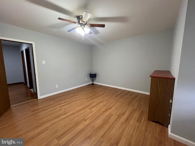 unfurnished room with ceiling fan and light hardwood / wood-style floors