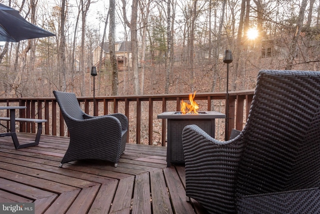 deck featuring an outdoor fire pit