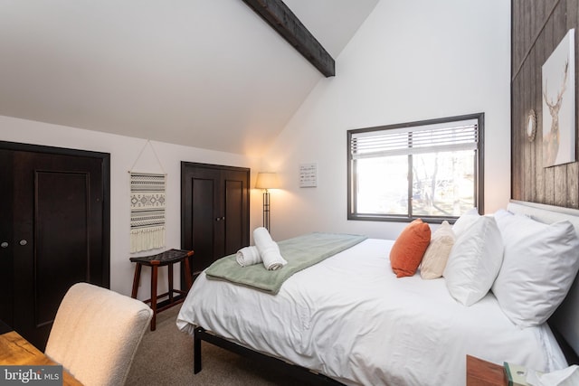 bedroom featuring carpet and lofted ceiling with beams