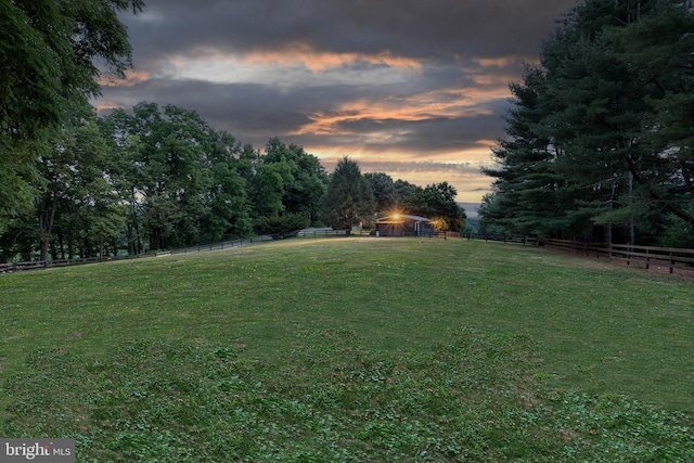 view of yard at dusk