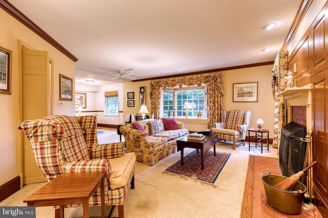 living room with a fireplace, light carpet, ceiling fan, and ornamental molding