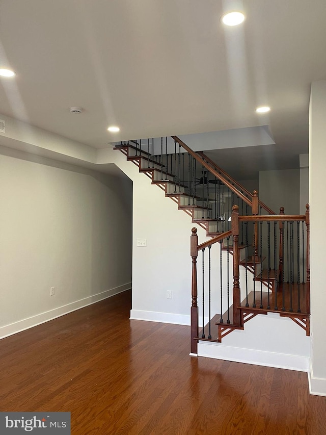 stairway with wood-type flooring