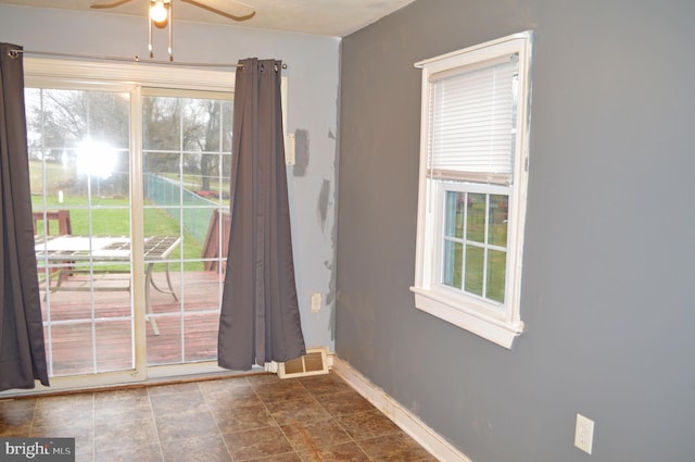 entryway featuring ceiling fan