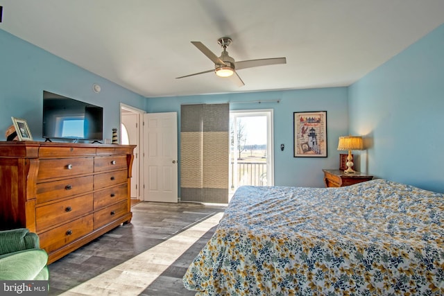 bedroom featuring ceiling fan, access to exterior, and dark hardwood / wood-style floors