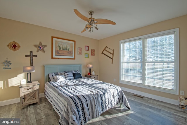 bedroom featuring ceiling fan and hardwood / wood-style floors