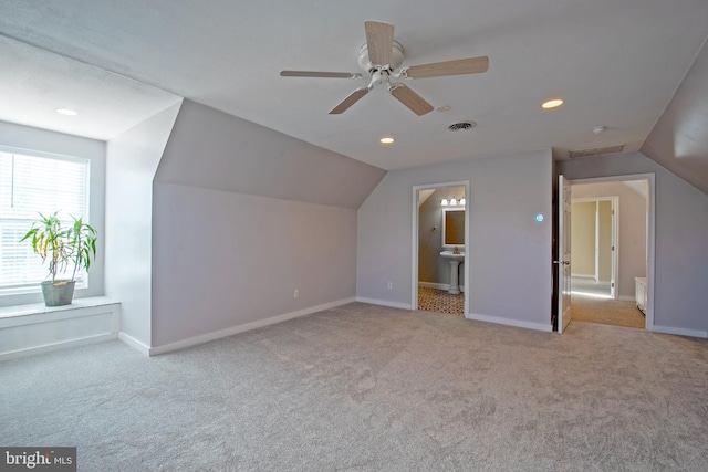 bonus room featuring vaulted ceiling, ceiling fan, and light carpet