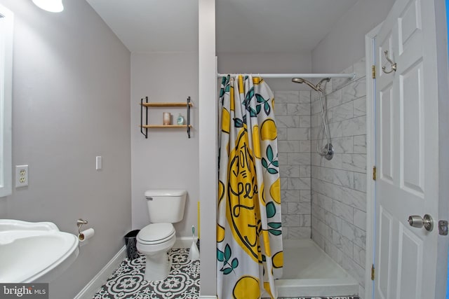 bathroom with toilet, tile patterned flooring, and a shower with shower curtain