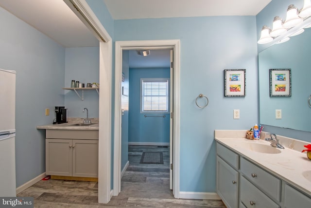 bathroom with wood-type flooring and vanity