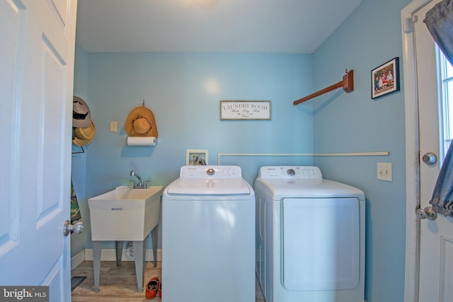 laundry room featuring separate washer and dryer and sink