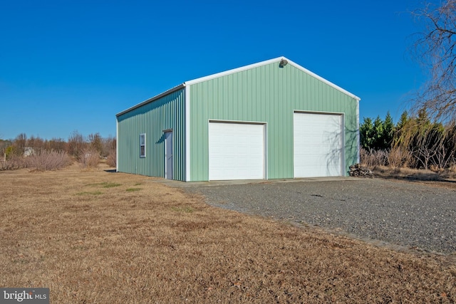 garage with a yard