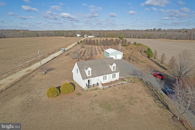 birds eye view of property with a rural view