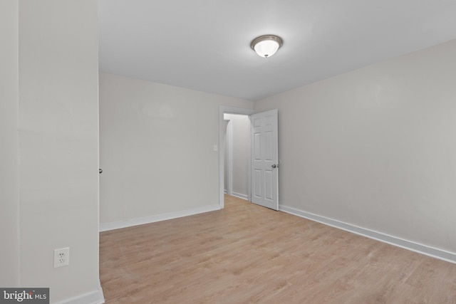 spare room featuring light wood-type flooring