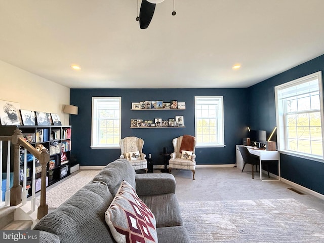 sitting room featuring ceiling fan and carpet floors