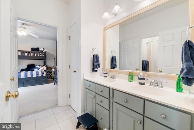 bathroom featuring tile patterned floors, ceiling fan, and vanity