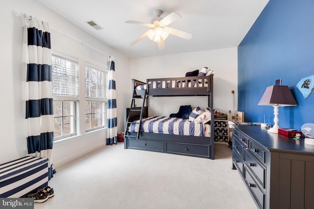 bedroom featuring ceiling fan and light colored carpet