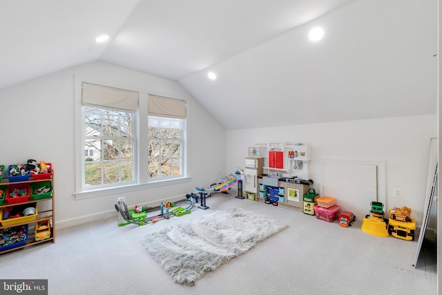 rec room featuring carpet and lofted ceiling