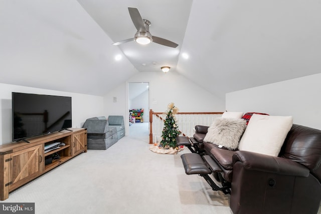 carpeted living room with vaulted ceiling and ceiling fan