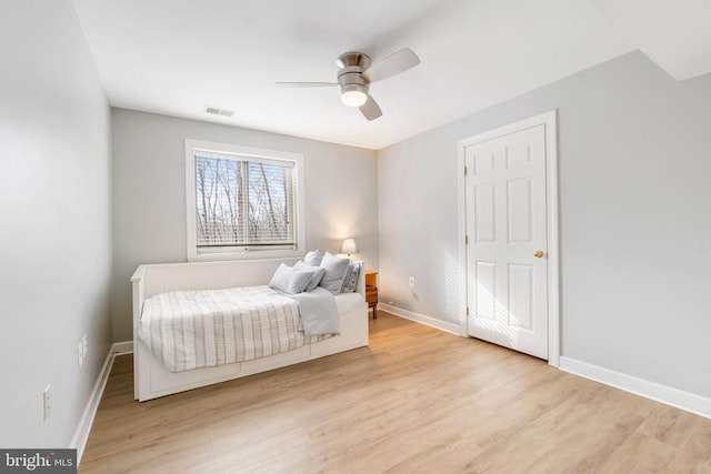 bedroom featuring ceiling fan and light wood-type flooring